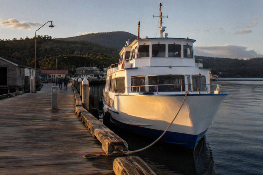 Cruise boat at a wharf in late afternoon light